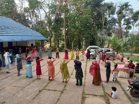 Women engaging in a group discussion during a programme